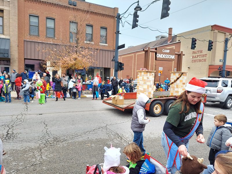 Holiday parade float handing out treats