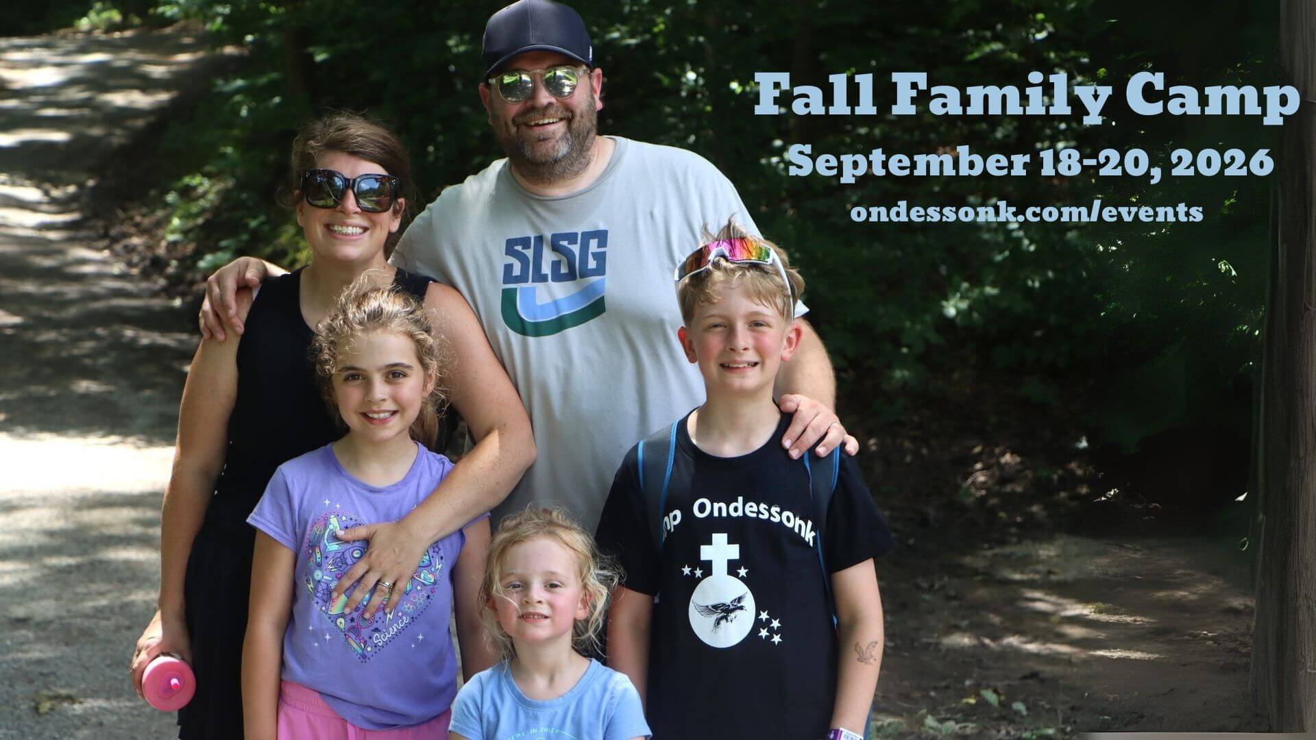 Family posing for Fall Family Camp photo.