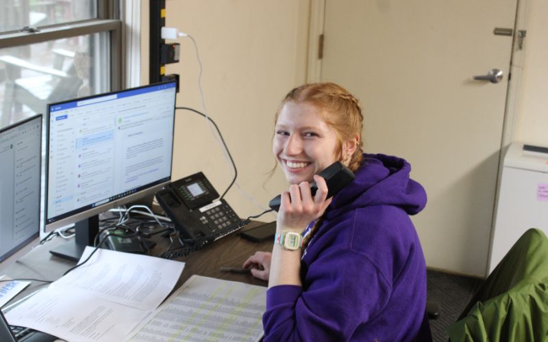 Volunteer smiling while answering telethon calls