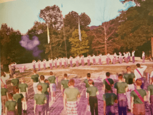 Boy Scouts standing in formation at camp.