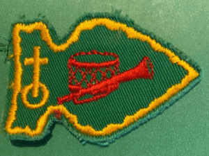 Green and yellow scout patch with drum and bugle.
