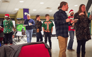 Group of people at Christmas gathering.