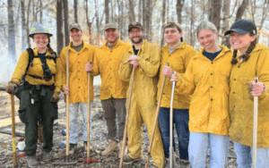 Wildfire crew posing with tools.