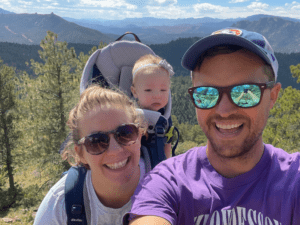 Family hiking in the mountains with a baby.