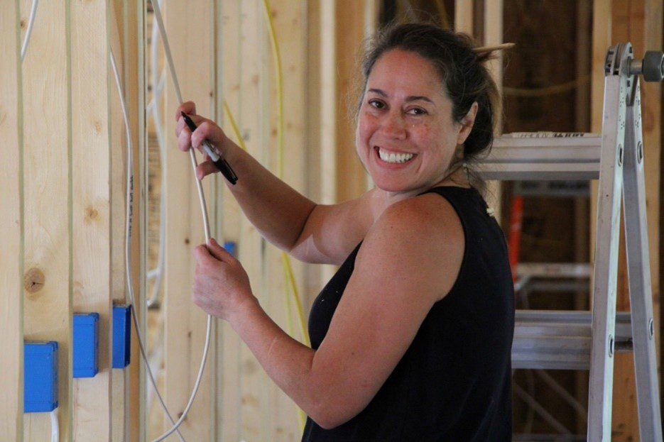 Continued progress on the Pete Korte Lodge. Kathy Alcorn working on wiring in the new staff duplex.