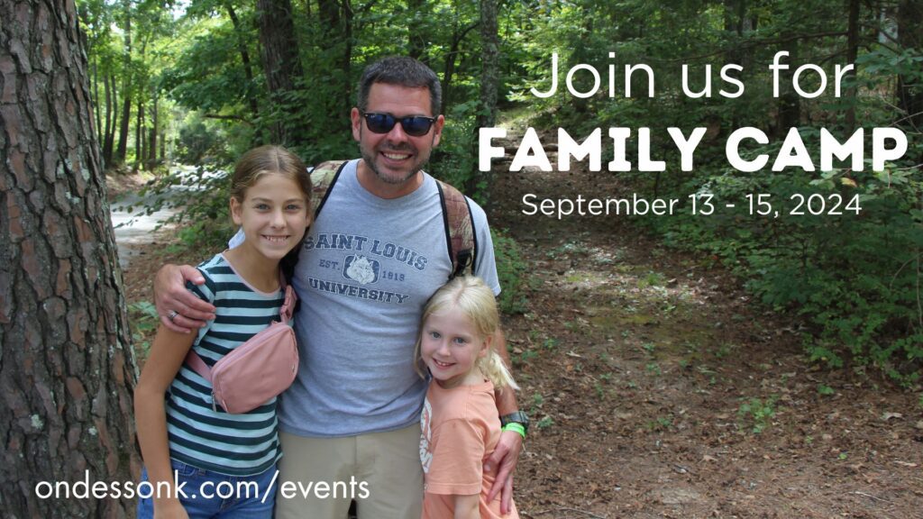 Smiling family on trail with Family Camp overlay