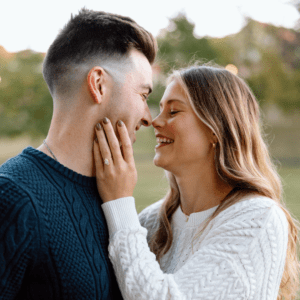 Engaged couple sharing a tender moment.