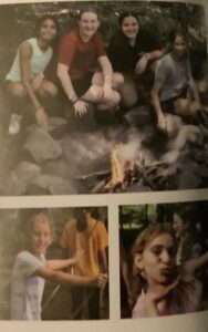 Girls around a campfire at summer camp