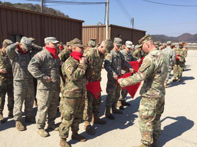 These soldiers are carrying on the legacy of Larry Garner by earning their red bandanas.