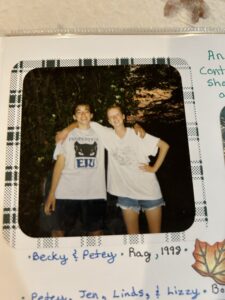 Two friends smiling outdoors in casual shirts