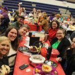 Group of people celebrating at a birthday party.