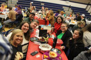 Group of people celebrating at a birthday party.