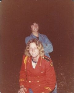 Two young men smiling for a photo.
