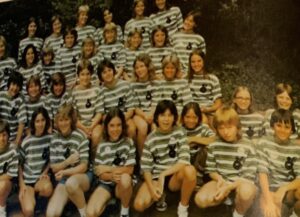 Group photo of girls in striped shirts.