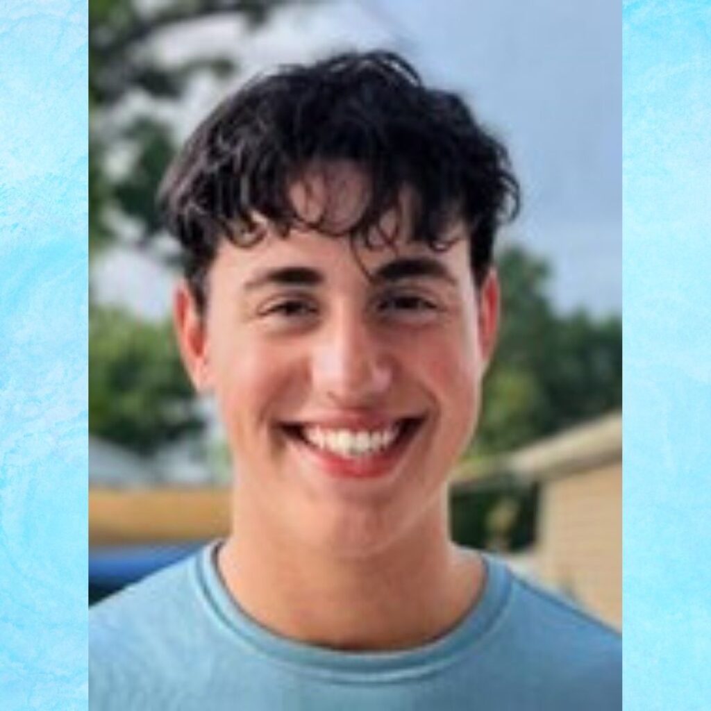 Smiling young man with curly dark hair