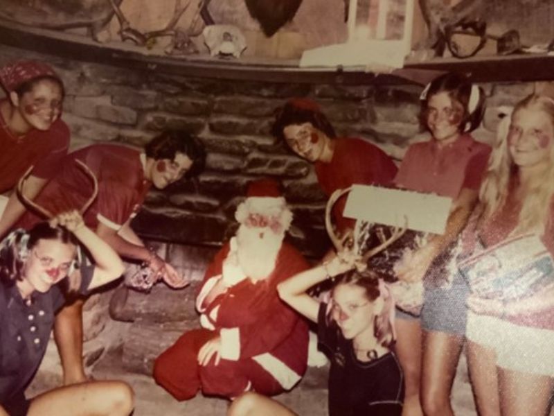 Kids dressed up for Christmas with Santa.