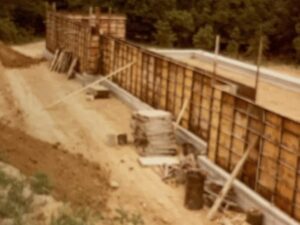 Wooden construction wall with support beams.