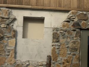 Stone wall with a window opening.