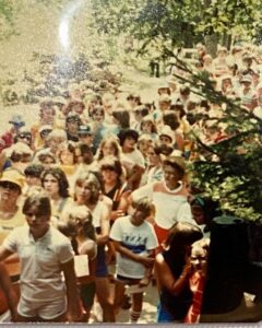 Large group of people in line outdoors.