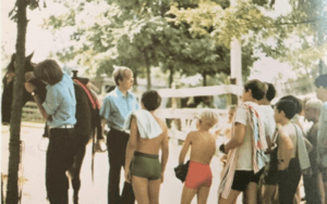 Children and a woman near a horse.