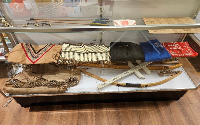 Display case with various cultural artifacts.