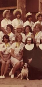Group photo, young women, nun, dog.