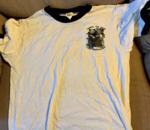 White t-shirt with Tommy the Bear logo.