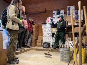 Workers organizing supplies in a warehouse.