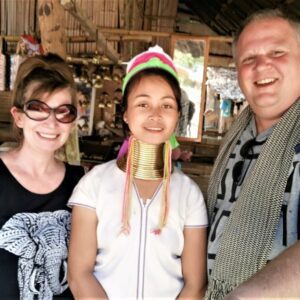 Woman with long neck rings and friends.