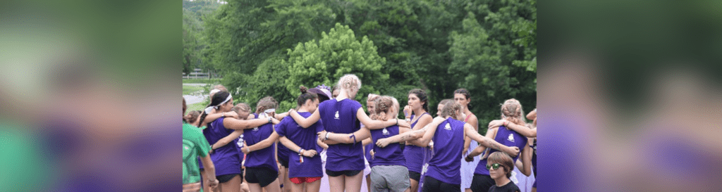 Team huddle in purple uniforms